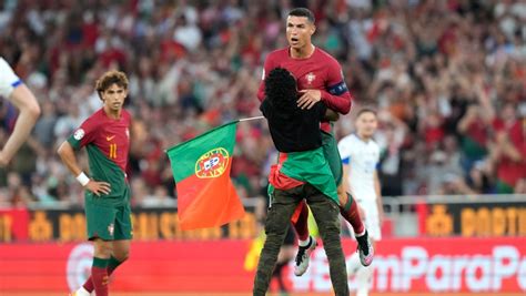 Cristiano Ronaldo hugged by fan as Portugal wins Euro qualifier | CTV News