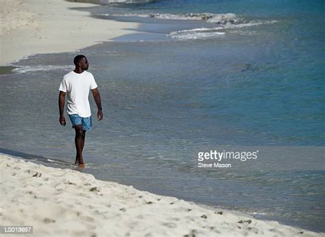 5,012 Black Man Walking On Beach Stock Photos, High-Res Pictures, and ...