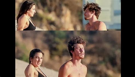 Shawn Mendes leaves footsteps on the beach with his mystery love