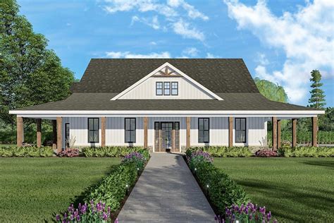 The symmetrical exterior of this ranch home plan, exclusive to ...