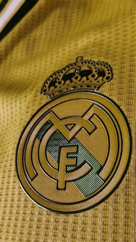 the real madrid jersey is shown in gold