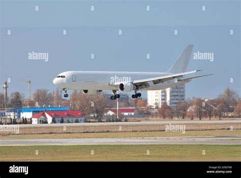 Cargo plane landing on the airport runway Stock Photo - Alamy