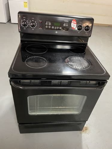 Ge refurbished black electric glass top stove working condition with warranty | BETTER APPLIANCES