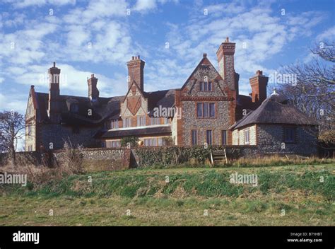 Happisburgh Manor built 1900 by Detmar Blow seen from coastal path Arts and Crafts house ...