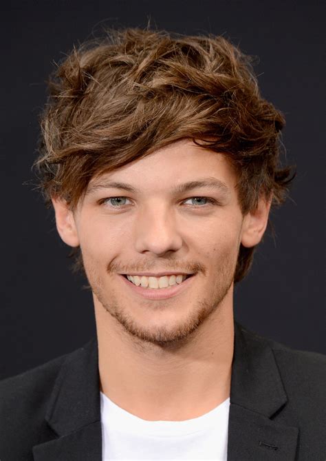 Louis Tomlinson was all smiles at the NYC premiere. | Aw! The One Direction Guys Match Outfits ...