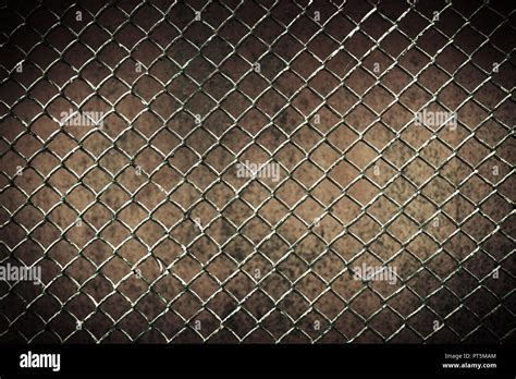 seamless tileable chain link fence wall in background Stock Photo - Alamy