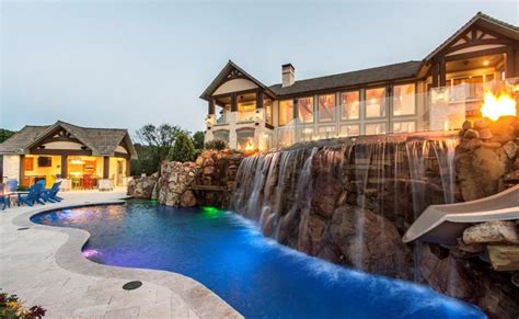 Lakefront Mansion In Denison, TX With 2 Pools & A Helipad | Homes of ...