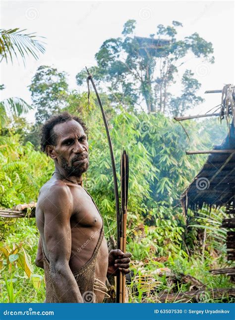 The Papuan From A Korowai Tribe, Live In The Houses Built On Trees. On ...