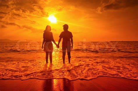 Happy couple at sunset on the beach | Stock image | Colourbox