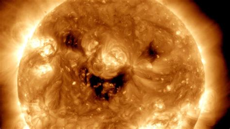 NASA captures ‘creepy smile of Sun’ in its latest…