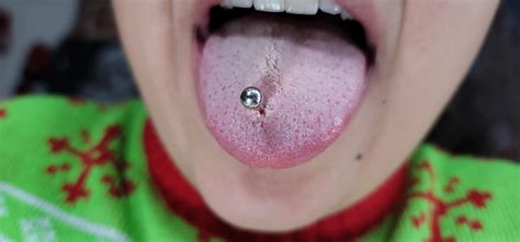 Why does my tongue piercing hurt and look torn after 4 months? : r/Legitpiercing