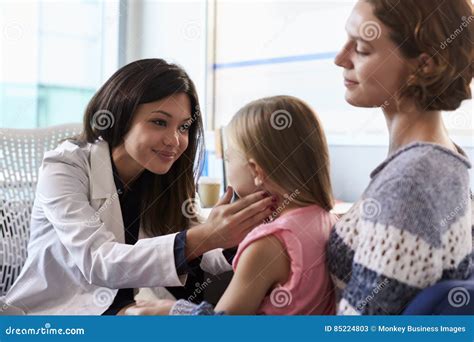 Female Pediatrician Using Otoscope Royalty-Free Stock Photo ...