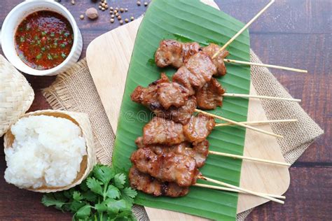 Moo Ping: Thai Grilled Pork and Sticky Rice with Spicy Dipping Sauce Stock Image - Image of ...