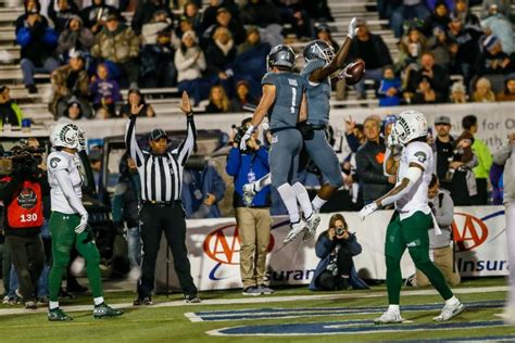 Wide receiver Romeo Doubs of the Nevada Wolf Pack celebrates getting... | Nevada wolf pack, Wolf ...