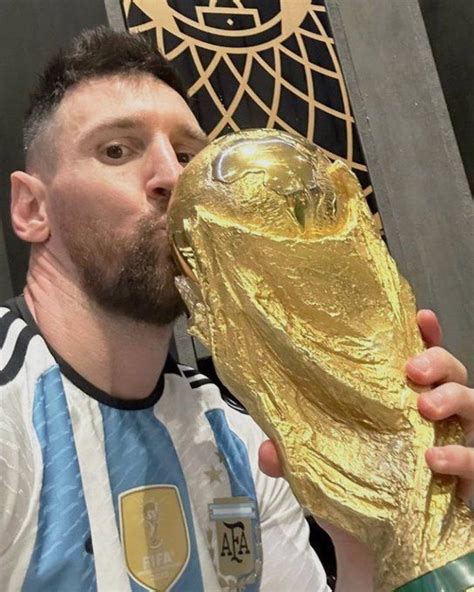 Messi captured kissing the World Cup trophy in Argentina's championship ...