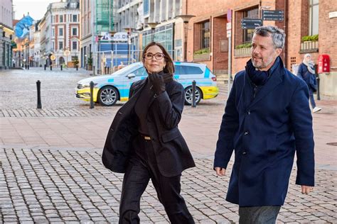 Crown Prince Frederik pictured holding hands with Princess Mary as they ...