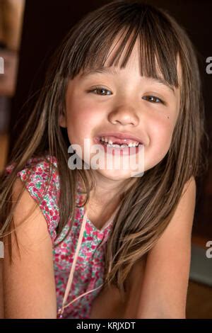 Girl missing front teeth Stock Photo - Alamy