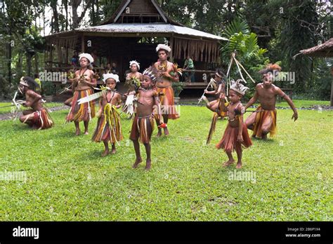 dh PNG village native dancers ALOTAU PAPUA NEW GUINEA Traditional children culture family ...