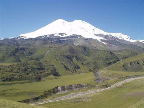 Mount Elbrus located in the western Caucasus mountain range, in Russia, near the border of ...