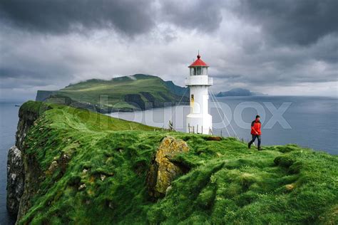 Hike to the lighthouse on Mykines, Faroe Islands | Stock image | Colourbox