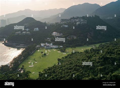 Houses on the hillside above Hong Kong Golf Club, Deep Water Bay, viewed from a highrise ...