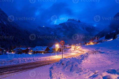 mountain village in alps at night 10681877 Stock Photo at Vecteezy