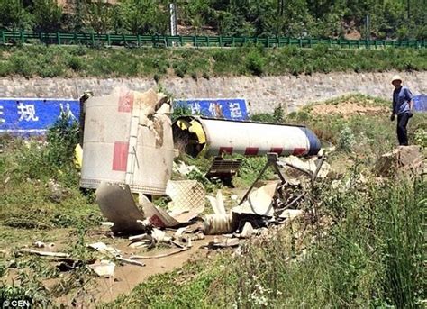 China residents stunned after huge chunks of rocket debris smashed into their village | Daily ...