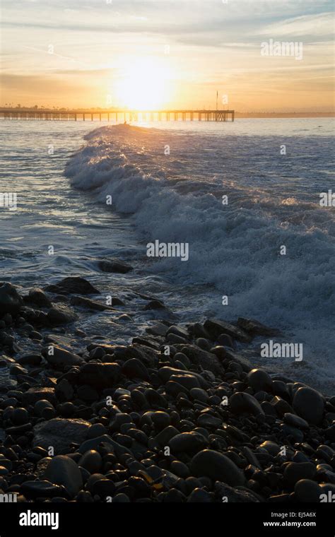 Ocean waves at sunrise with Ventura Pier, Ventura, California, USA ...