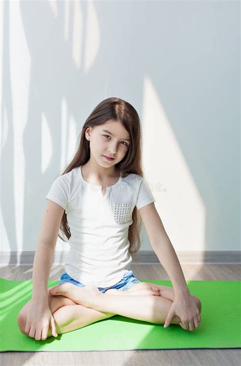 Little Girl Doing Yoga Exercises In A Fitness Studio Stock Image - Image: 69866233