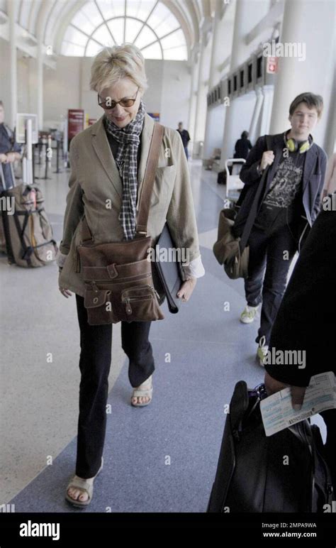 Annette Bening and her son Benjamin arrive at LAX and after checking in are escorted to their ...