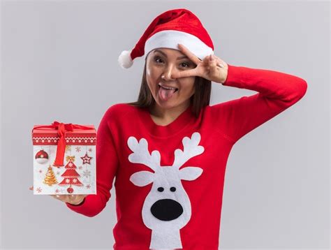 Free Photo | Joyful young asian girl wearing christmas hat with sweater ...