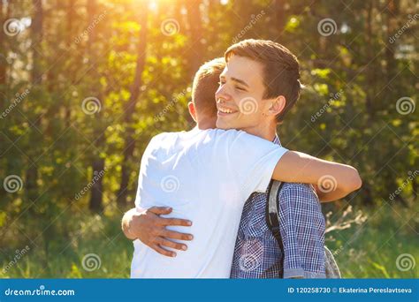 Two Guy Friends Hugging