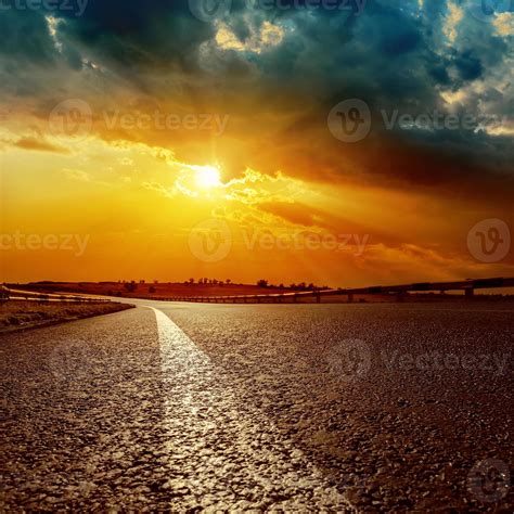 dramatic sunset and asphalt road to horizon 1158102 Stock Photo at Vecteezy