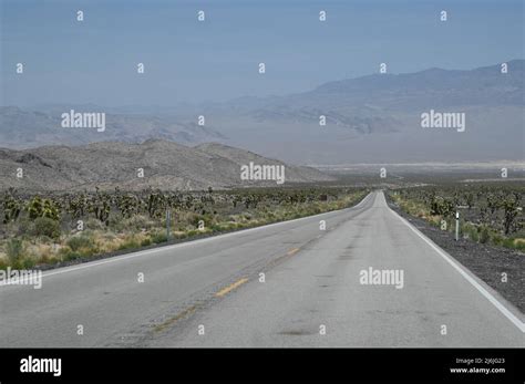 A long desert road in Nevada USA Stock Photo - Alamy