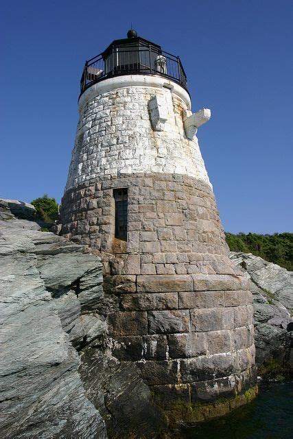 a light house sitting on top of a rocky cliff