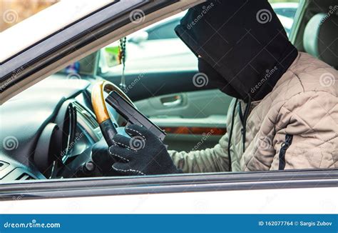 Weapons thief steals a car stock photo. Image of plan - 162077764