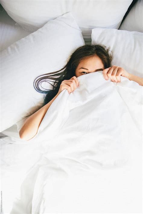 Young Woman Hiding Under Blanket In Bed | Stocksy United | Home photo shoots, Photoshoot ...