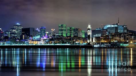 Downtown Montreal in winter. Night shot with reflected city ligh ...