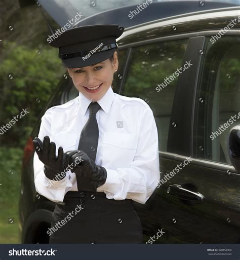 Woman Chauffeur Putting On Her Uniform Stock Photo 320858900 - Shutterstock