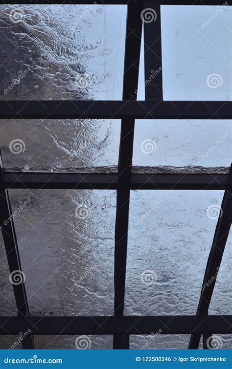 A Heavy Rain Pours on a Window with Wooden Frames Stock Photo - Image ...