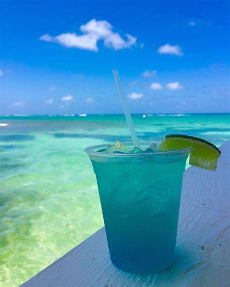 We like drinks that match the water. | Cheap caribbean, Vacation resorts, Cayman