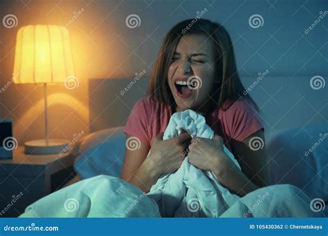 Young Scared Woman Sitting on Bed Stock Photo - Image of problem, disorders: 105430362