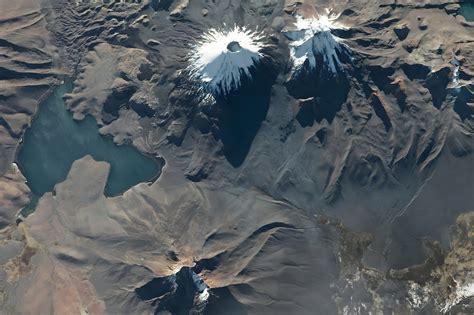 Twin volcanoes in the Andes Mountains • Earth.com