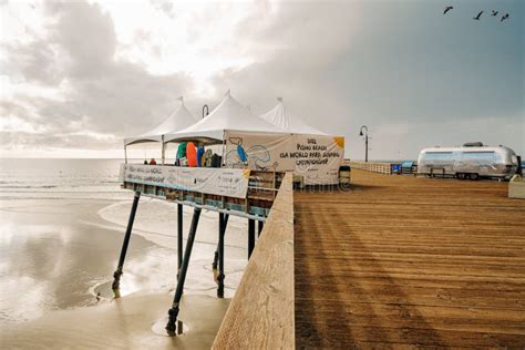 Pismo Beach Pier during ISA World Para Surfing Championship. Long Wooden Pier, Sandy Beach, and ...