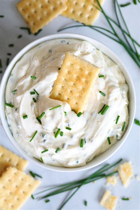 Aerial view of Garlic Cream Cheese Dip with a cracker in it and more on ...