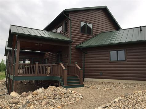 Autumn Brown TruLog steel siding with green roof. Maintenance-free log ...