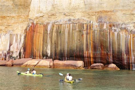 Colorful Sandstone Cliffs and Formations Welcoming Kayakers at Pictured Rocks National Lakeshore ...