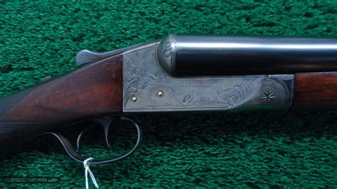 ITHACA DOUBLE BARRELED HAMMERLESS SHOTGUN