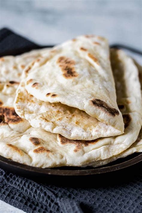 This tasty, light and fluffy easy naan bread recipe is ready in just 15 minutes with 4 ...