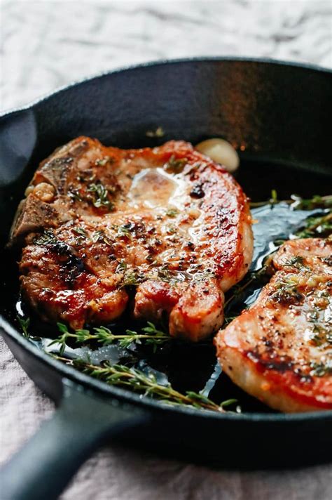 CLose-up view of the Garlic Butter Baked Pork Chops recipe | Baked pork, Pork chop recipes baked ...